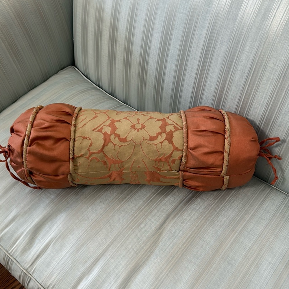 Gorgeous, rust and muted gold colored bolster pillow